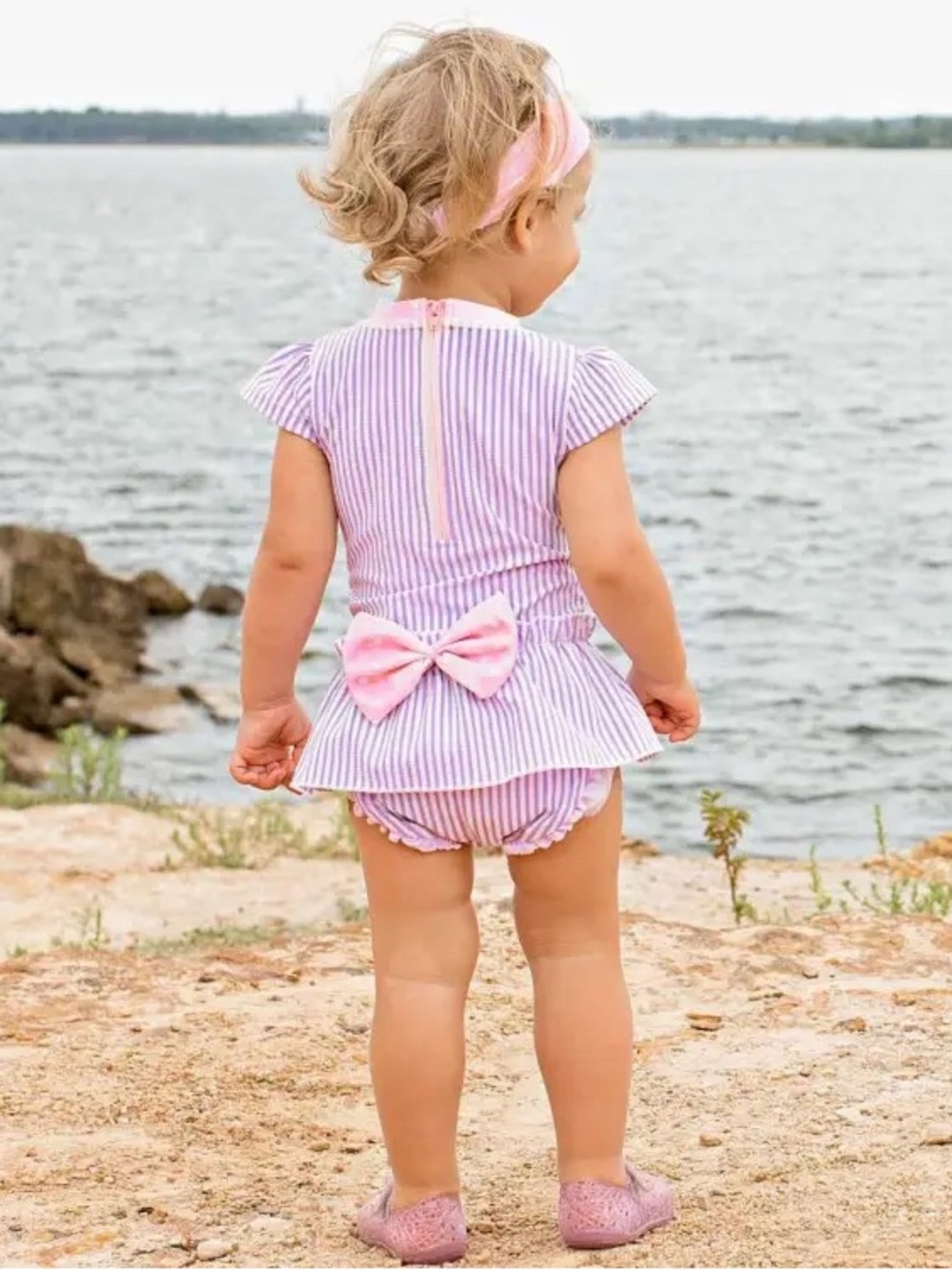 RuffleButts Lilac Seersucker Bow Peplum Swimsuit 6–12M